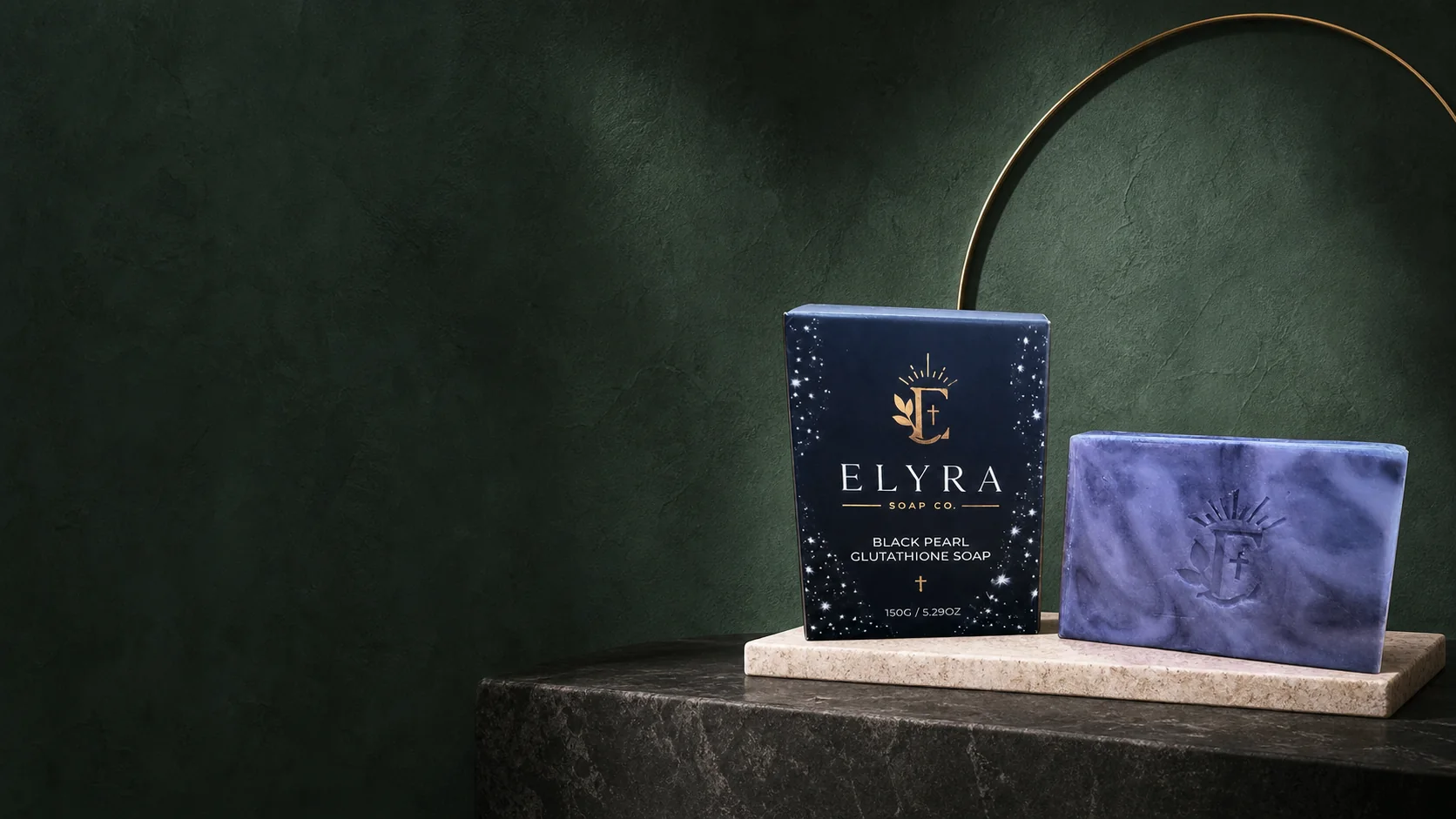 Elyra Black Pearl Glutathione Soap in a deep green campaign setting.